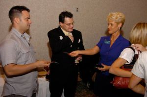 Exchanging business cards at the Kick-Off Event